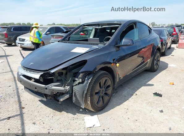 7SAYGDED6SA359486 2025 TESLA MODEL Y Gray წინა მარცხენა ხედი სამი მეოთხედიდან