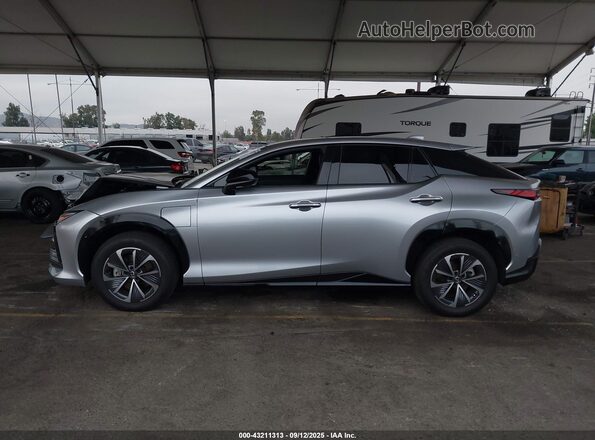 JTJAAAAB4PA016615 2023 LEXUS RZ Silver Vista interior trasera