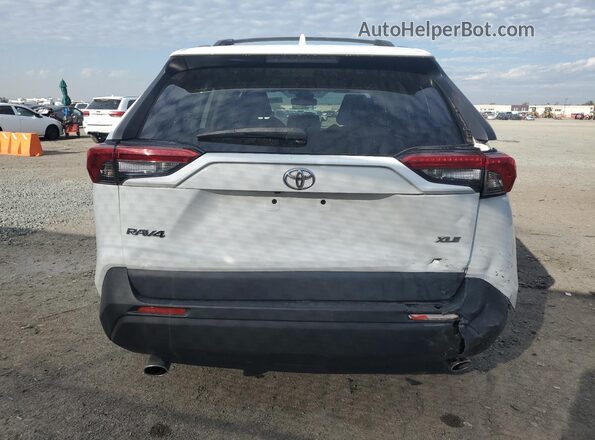 JTMW1RFV5KJ013757 2019 TOYOTA LE White Rear view