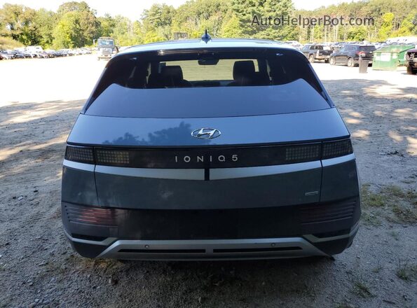 KM8KNDAF2PU207329 2023 HYUNDAI IONIQ Blue Rear view