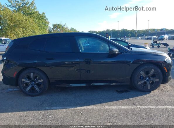 WB523CF07SCU29481 2025 BMW IX Black Вид задньої частини салону