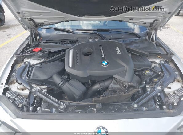WBA2K9C58HV647160 2017 BMW 2 SERIES Silver Вид ззаду
