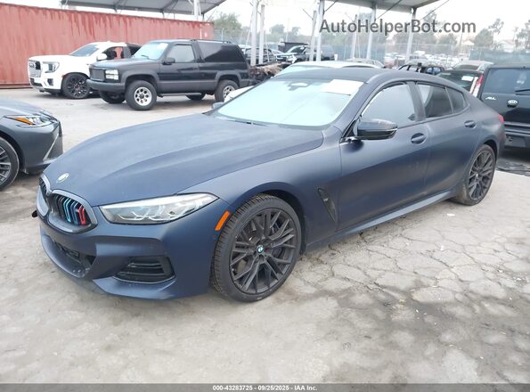 WBAGV8C07PCK50254 2023 BMW M8 Black Առջևի ձախ երեք քառորդ տեսարան