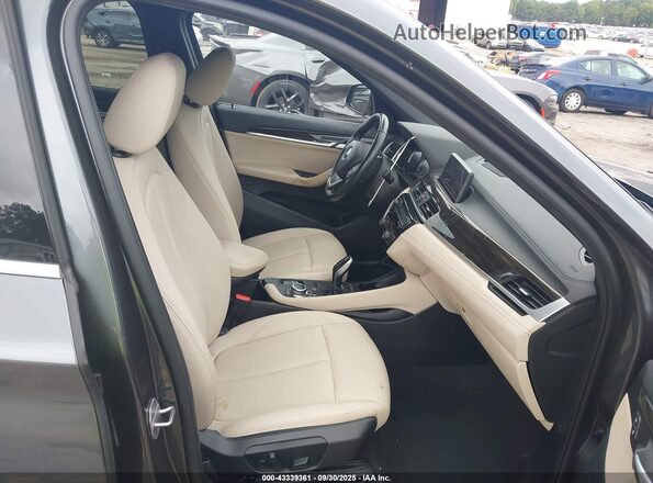 WBXJG7C08M5S17005 2021 BMW X1 Gray Front interior view