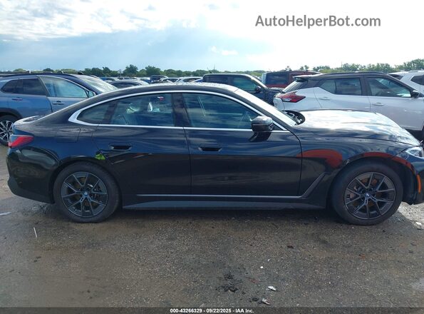 WBY43AW03RFT30343 2024 BMW I4 Black Vista interior trasera