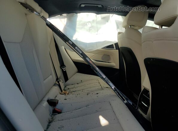 WBY43HD09SFU47703 2025 BMW I4 Teal Rear seats view