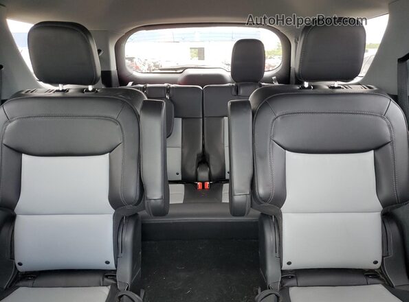 1FMSK8DHXRGA00976 2024 FORD FORD EXPLORER Silver Rear seats view