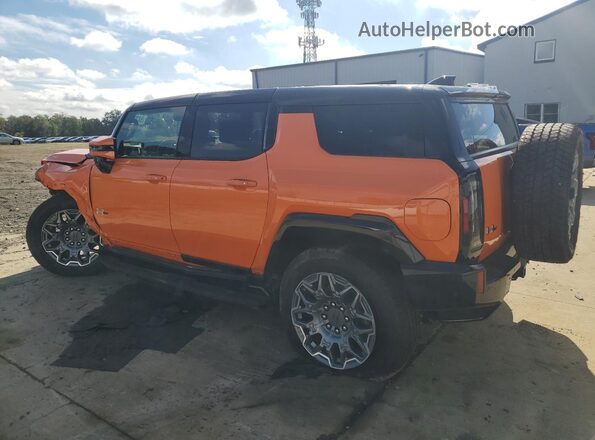 1GKB0RDCXRU113305 2024 GMC HUMMER Orange Trasero izquierdo