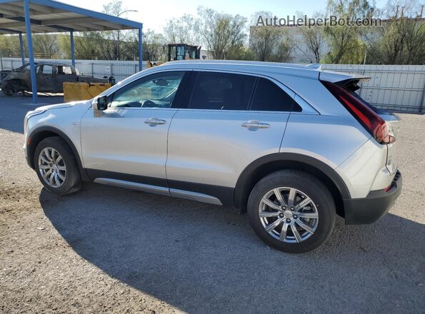 1GYFZDR42NF135962 2022 CADILLAC XT4 Silver Trasero izquierdo