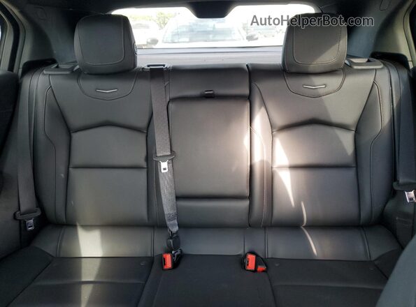 1GYFZER42NF100375 2022 CADILLAC XT4 White Widok tylnych siedzeń