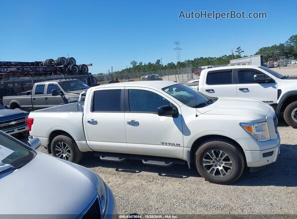 1N6AA1EF8MN515385 2021 NISSAN TITAN Белый Вид задней части салона