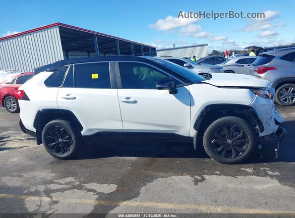 2T3E6RFV5PW045789 2023 TOYOTA RAV4 HYBRID White Vista interior trasera