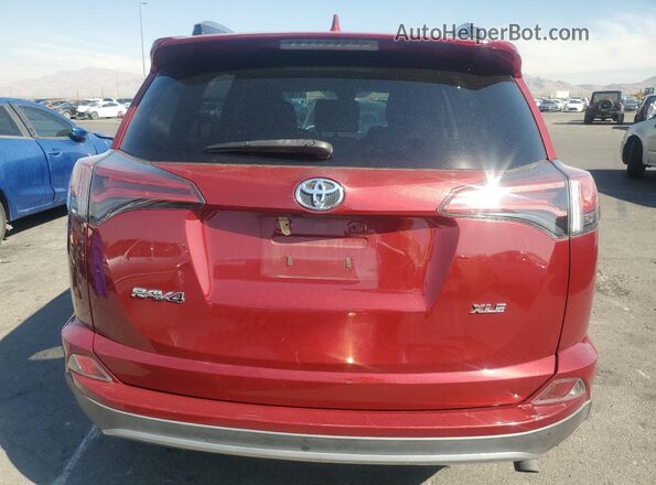 2T3WFREV9JW467559 2018 TOYOTA RAV4 Burgundy Vista trasera
