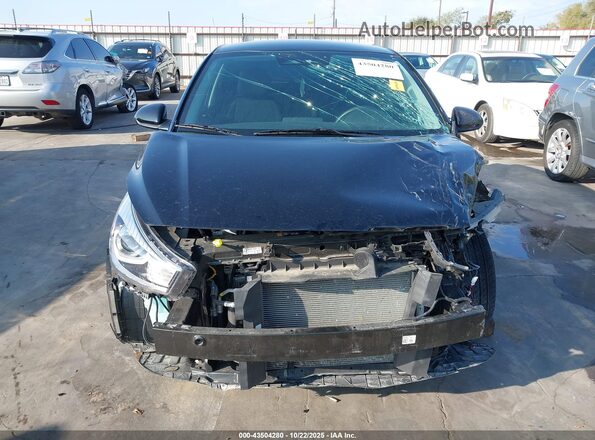 3KPA25AD2PE627281 2023 KIA RIO 5-DOOR Black Vista interior trasera