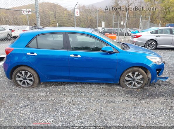 3KPA25AD8PE590849 2023 KIA RIO 5-DOOR Blue უკანა სალონის ხედი