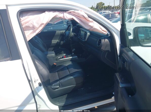 3TMCZ5AN0LM319653 2020 TOYOTA TACOMA White Front interior view