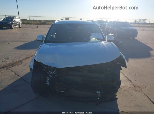 3VVEX7B27RM115232 2024 VOLKSWAGEN TAOS White Rear interior view