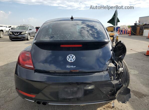 3VWJD7AT4JM727714 2018 VOLKSWAGEN BEETLE Black Rear view