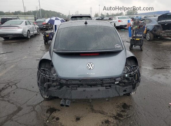 3VWJD7AT7JM706694 2018 VOLKSWAGEN BEETLE Gray Rear view