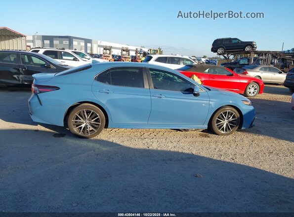 4T1G31AK8RU073338 2024 TOYOTA CAMRY HYBRID Blue Вид задньої частини салону