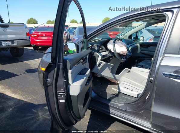 5FNRL6H84PB018606 2023 HONDA ODYSSEY Серый Вид салона спереди
