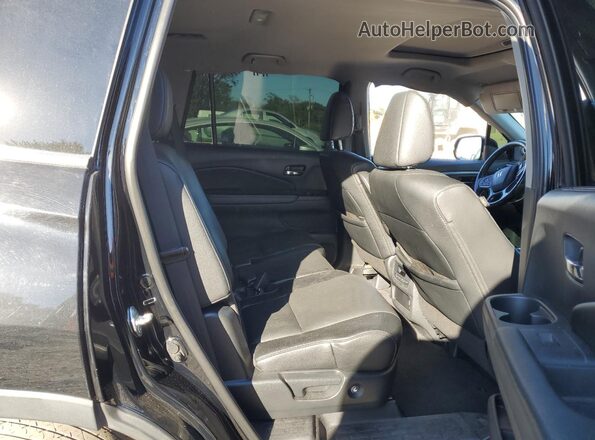 5FNYF6H22MB096747 2021 HONDA PILOT Black Rear interior view