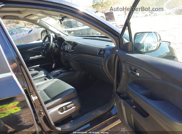 5FNYF6H23MB024245 2021 HONDA PILOT Black Front interior view