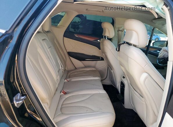 5LMCJ3C91GUJ28412 2016 LINCOLN MKC Black Vista interior trasera