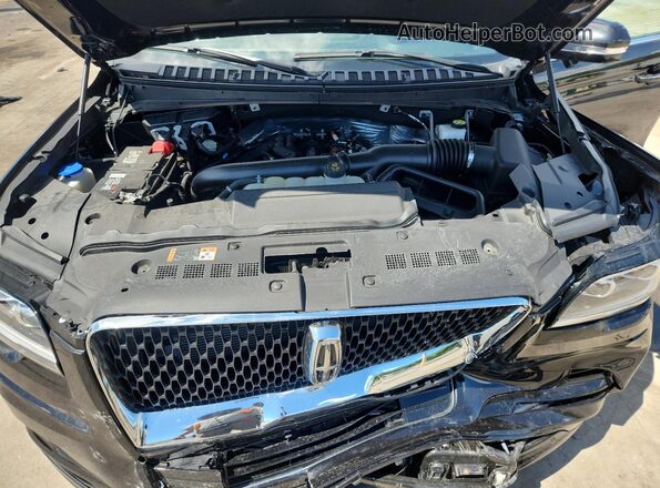 5LMJJ2LG0REL20093 2024 LINCOLN NAVIGATOR Черный Вид задней части салона