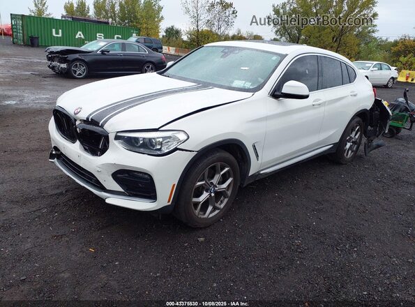 5UX2V1C08L9B34705 2020 BMW X4 White Առջևի ձախ երեք քառորդ տեսարան