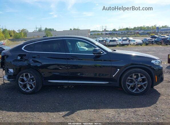 5UX33DT07R9V46499 2024 BMW X4 Black Widok wnętrza z tyłu