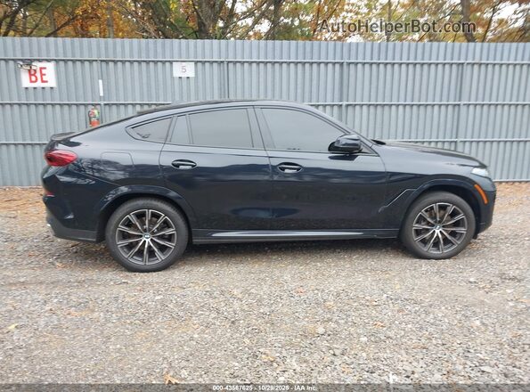 5UX33EX00R9V06829 2024 BMW X6 Blue Rear interior view