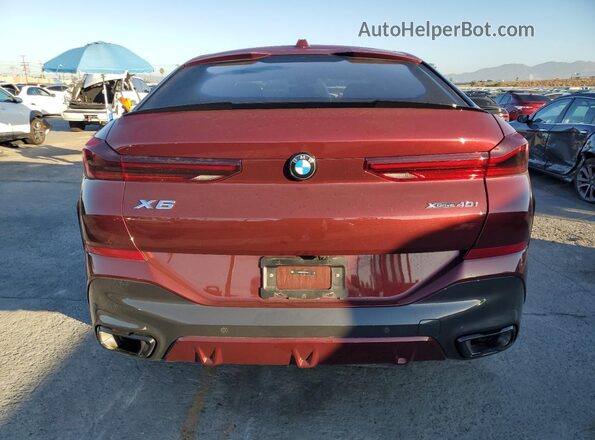 5UX33EX07R9V41884 2024 BMW X6 Maroon Widok z tyłu