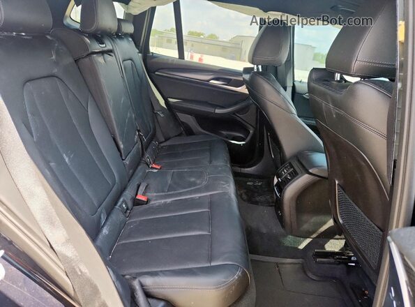 5UX43DP01P9P29585 2023 BMW X3 Blue Rear interior view