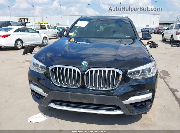 5UXTY3C07M9F04910 2021 BMW X3 Black Սալոնի հետևի տեսք