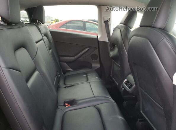 7SAYGAEE6NF314563 2022 TESLA MODEL Burgundy უკანა სავარძლების ხედი