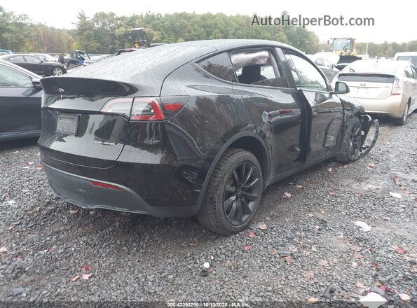 7SAYGAEEXRF060832 2024 TESLA MODEL Y Black Tył prawy