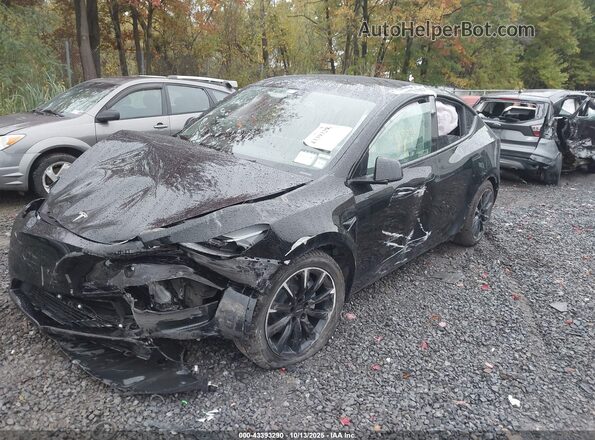 7SAYGAEEXRF060832 2024 TESLA MODEL Y Black Przód lewy