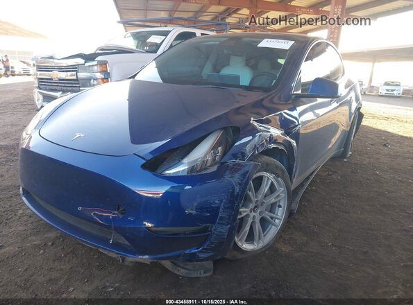 7SAYGDEE7NF446216 2022 TESLA MODEL Y Blue წინა მარცხენა ხედი სამი მეოთხედიდან