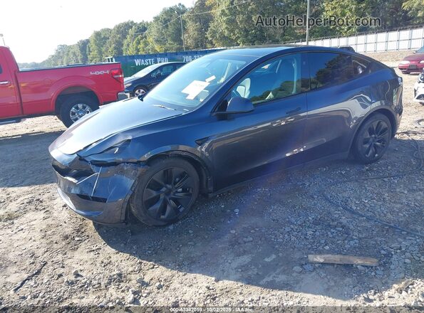 7SAYGDEE7RA294540 2024 TESLA MODEL Y Gray წინა მარცხენა ხედი სამი მეოთხედიდან