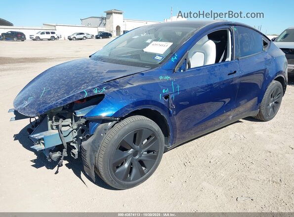 7SAYGDEE7RA323793 2024 TESLA MODEL Y Blue წინა მარცხენა ხედი სამი მეოთხედიდან