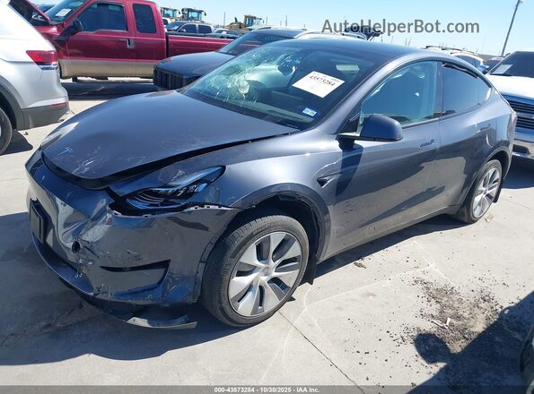 7SAYGDEE9PA120577 2023 TESLA MODEL Y Gray Vista tres cuartos delantera izquierda