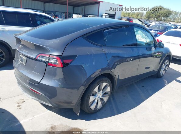 7SAYGDEE9PA120577 2023 TESLA MODEL Y Gray Trasero derecho