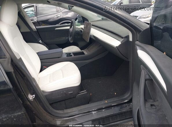 7SAYGDEF2NF555644 2022 TESLA MODEL Y Black Вид салону спереду