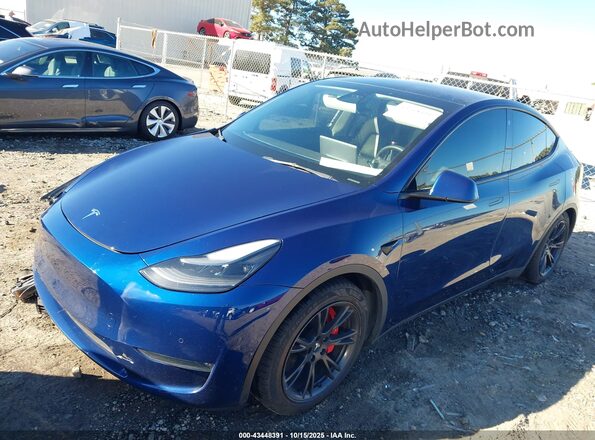 7SAYGDEF7NF374796 2022 TESLA MODEL Y Dark Blue წინა მარცხენა ხედი სამი მეოთხედიდან