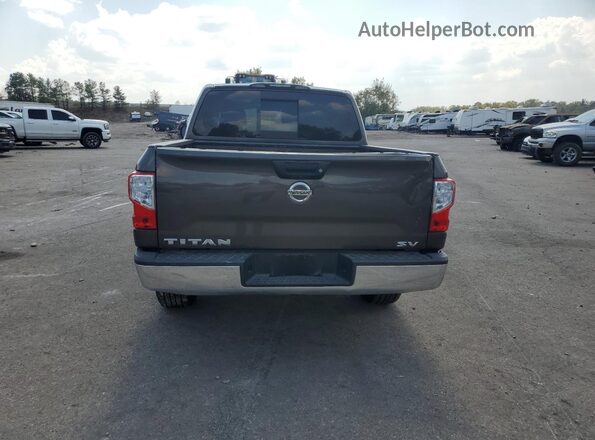 1N6AA1EKXKN523949 2019 NISSAN TITAN Brown Вид салону спереду