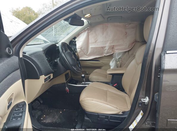 JA4AD3A34KZ047558 2019 MITSUBISHI OUTLANDER Brown Front interior view