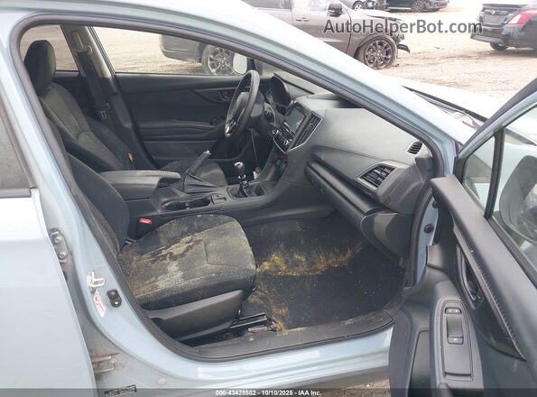 JF2GTAAC7KG217660 2019 SUBARU CROSSTREK Light Blue Вид салона спереди