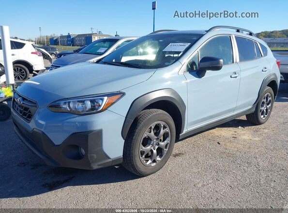 JF2GTHRC8MH303392 2021 SUBARU CROSSTREK Light Blue Vista tres cuartos delantera izquierda