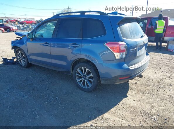 JF2SJGWC1JH528652 2018 SUBARU FORESTER2. Blue Trasero izquierdo